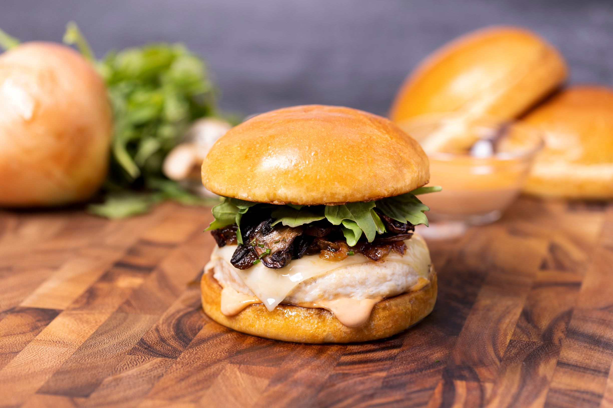 Mushroom Swiss Chicken Burger with Arugula and Caramelized Onions