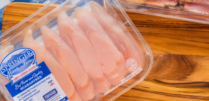Raw boneless skinless chicken tenderloins in packaged tray