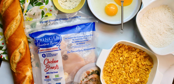 Springer Mountain Farms chicken breasts with breading ingredients including eggs, flour, and crushed cornflakes for homemade crispy fried chicken.