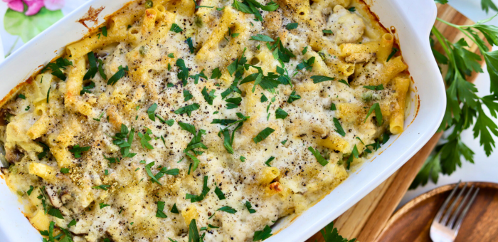 Creamy dump-and-bake chicken stroganoff casserole topped with melted cheese and parsley in a white baking dish — easy freezer-friendly chicken dinner recipe.