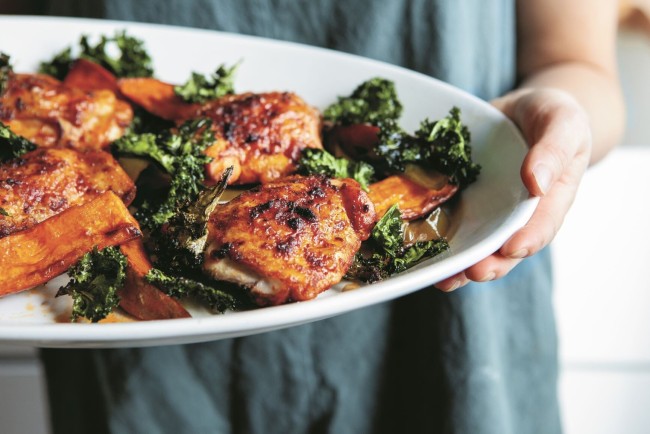 Paprika Chicken With Sweet Potatoes And A Crispy Kale Crown in the plate