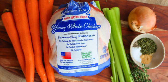 Springer Mountain Farms Young Whole Chicken with fresh carrots, celery, and onion — all-natural, antibiotic-free poultry perfect for roasting or meal prep.