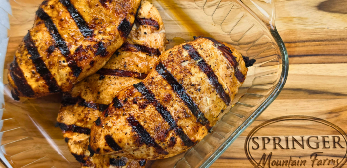 Juicy grilled chicken breast with grill marks plated and ready to serve